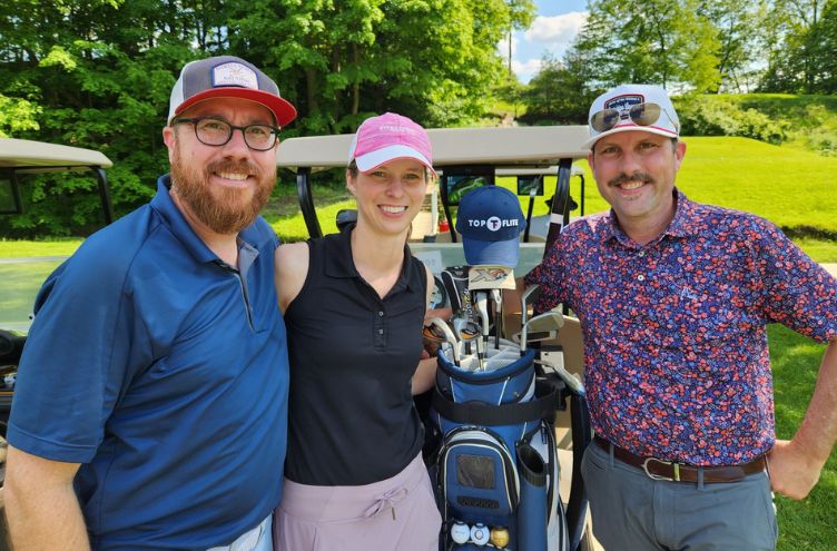 team with golf clubs and cart