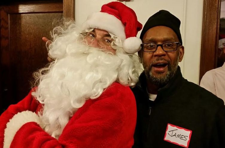 James Johnson posing with Santa